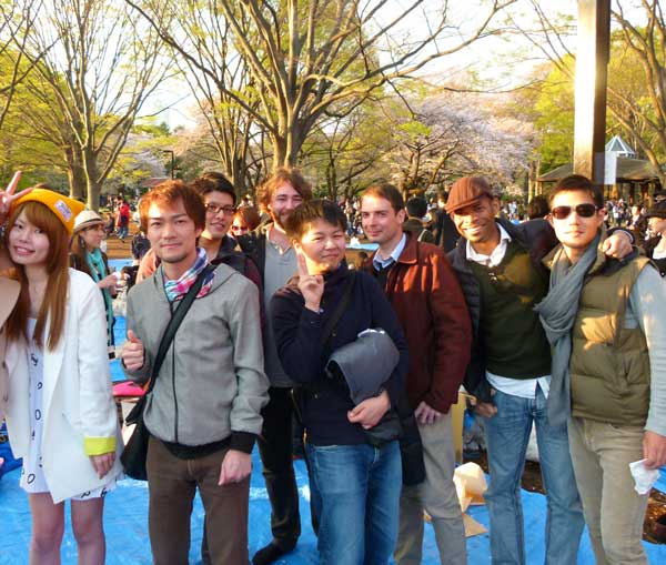 A group of partygoers at hanami in Yoyogi Park